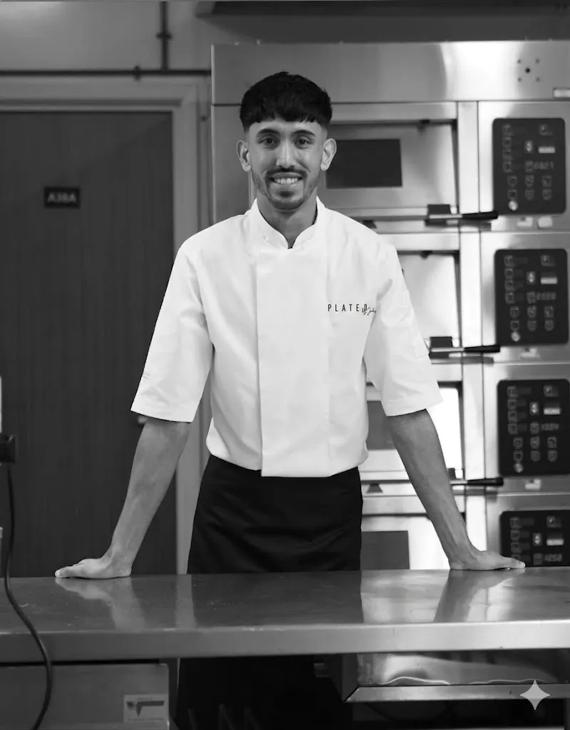 Chef Jubz, portrait with the Chefs' Forum jacket logo.